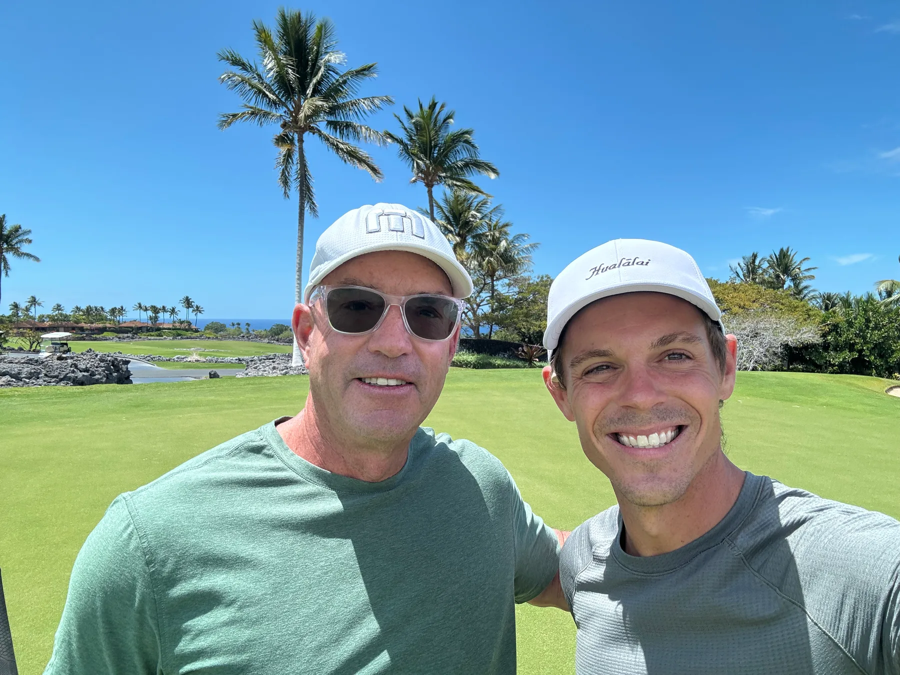 Seth and a fellow golfer on the course