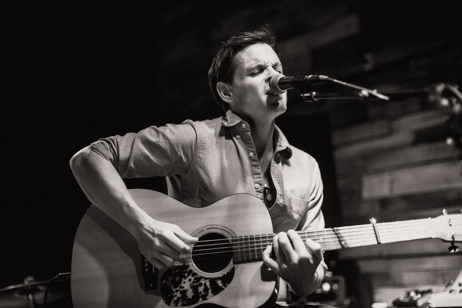 Seth singing and playing acoustic guitar
