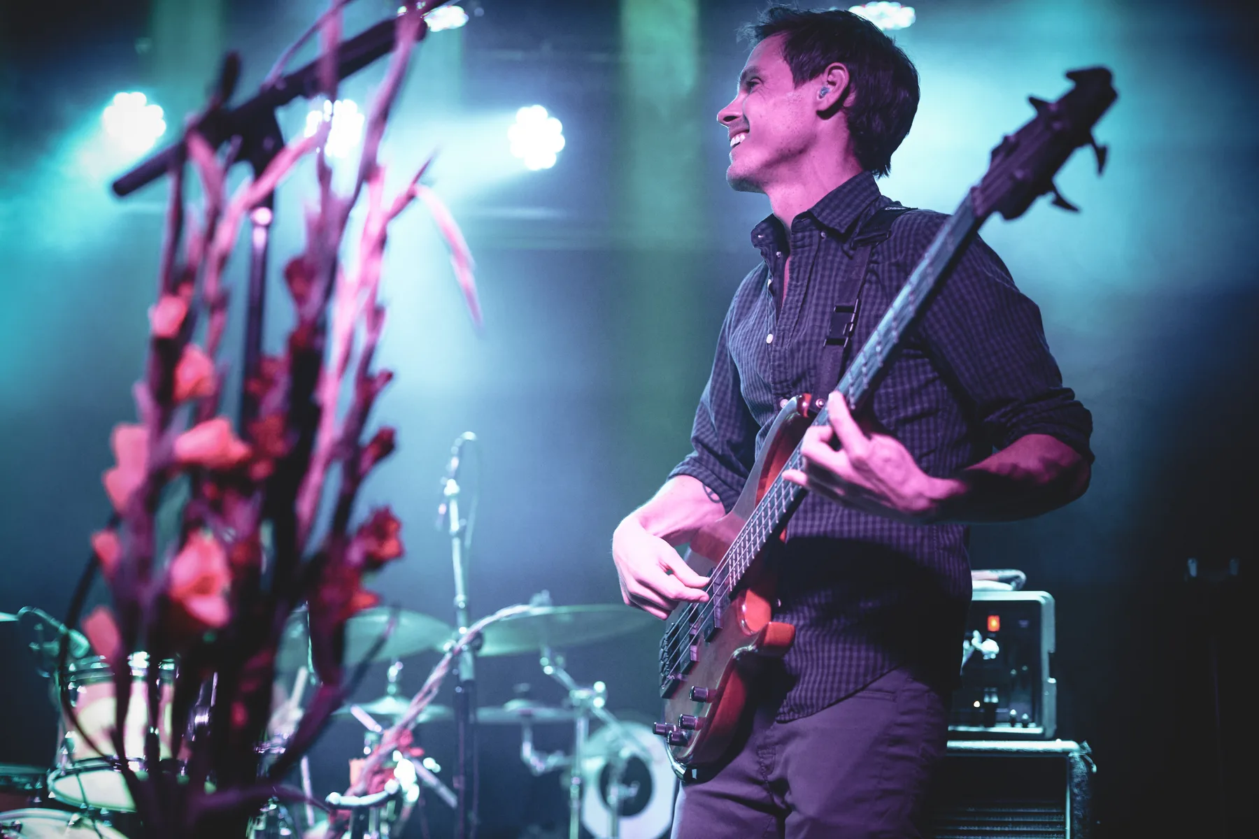 Seth playing bass under stage lights