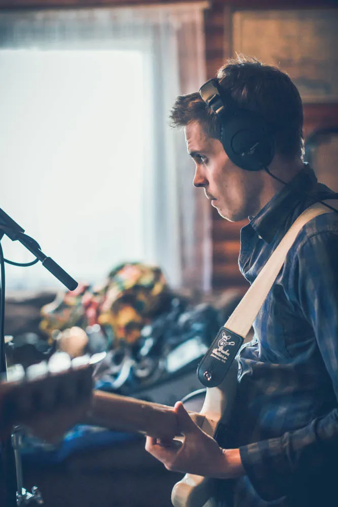 Seth recording guitar in the studio