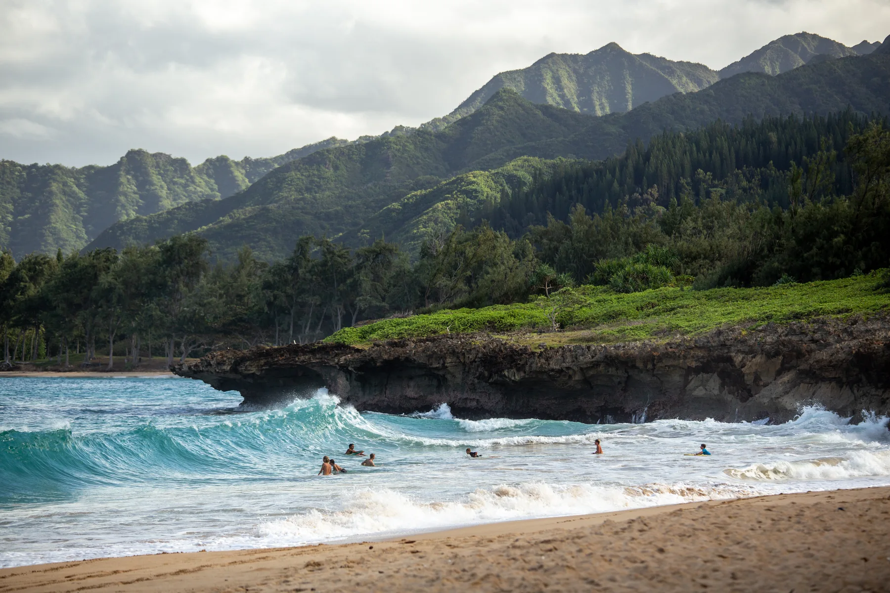 Waves along a mountainous Hawaiian coastline