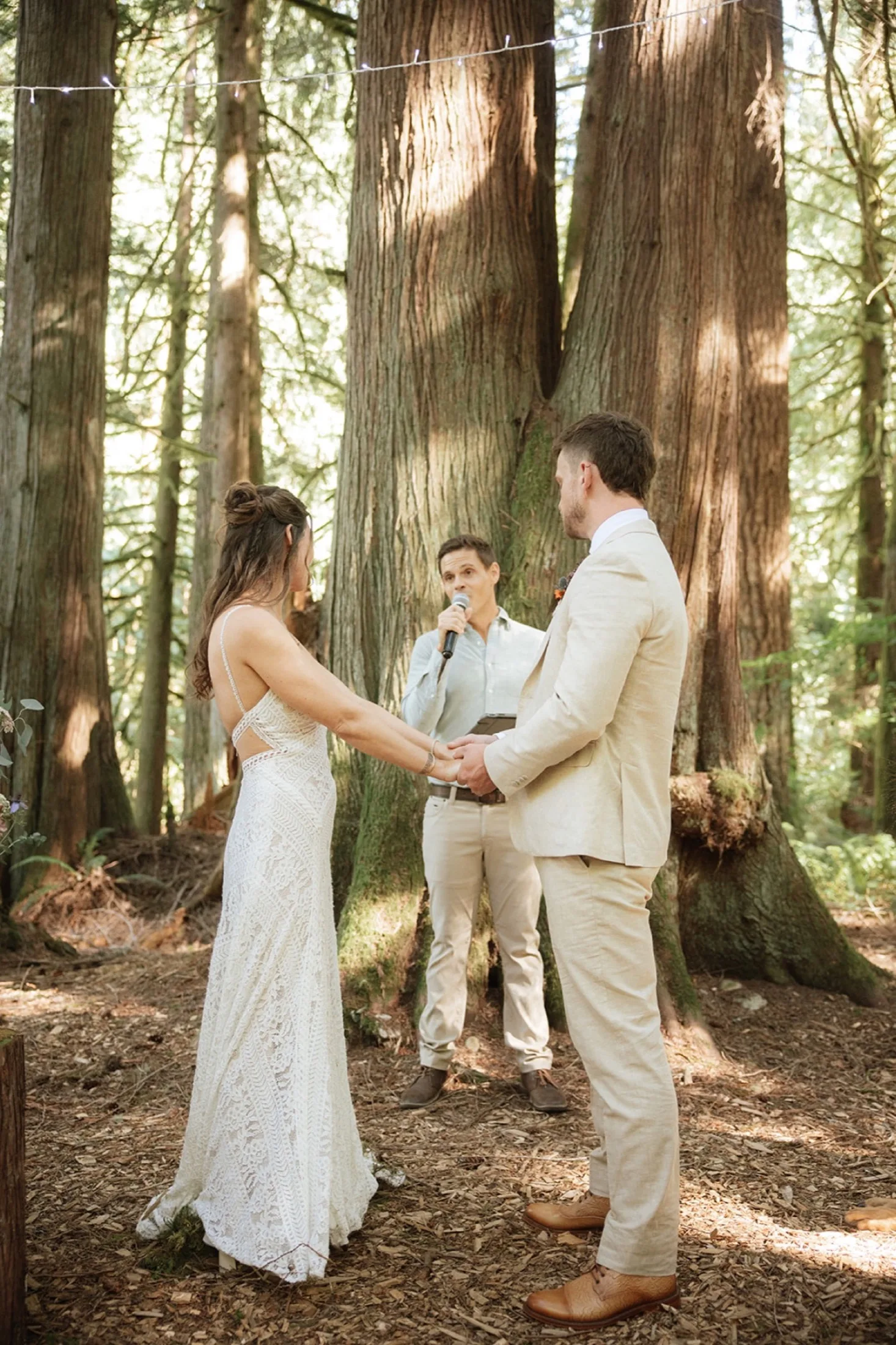 Seth Marcus guiding a wedding ceremony in a redwood forest